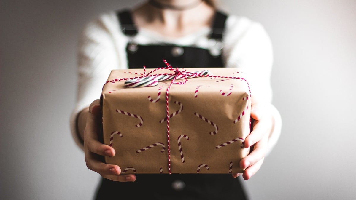 Christmas gift in persons hands