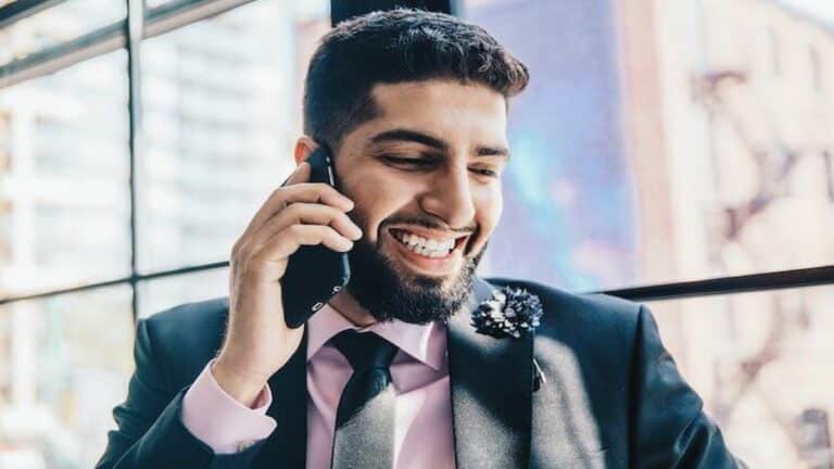 man using phone with 800 business