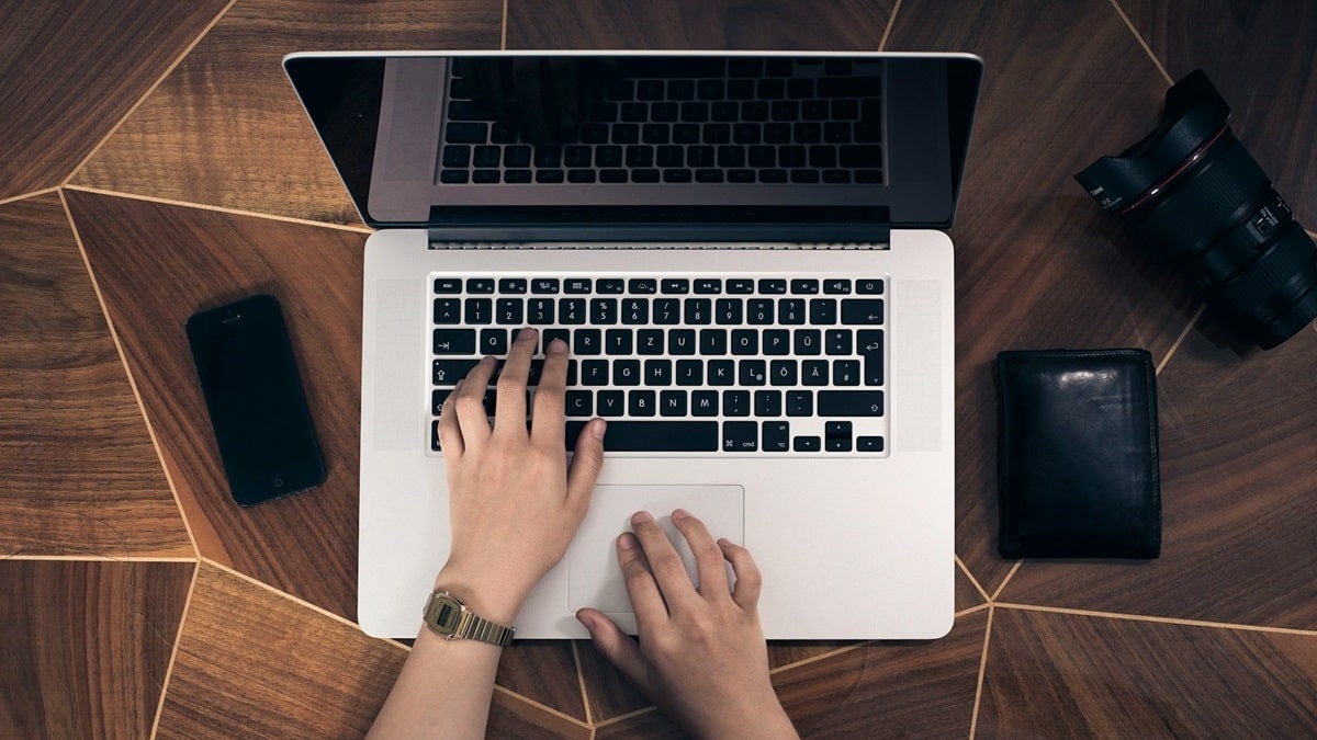 person doing task on laptop